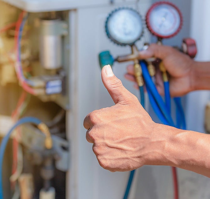 Thumbs up with a pressure testing gangue in the background